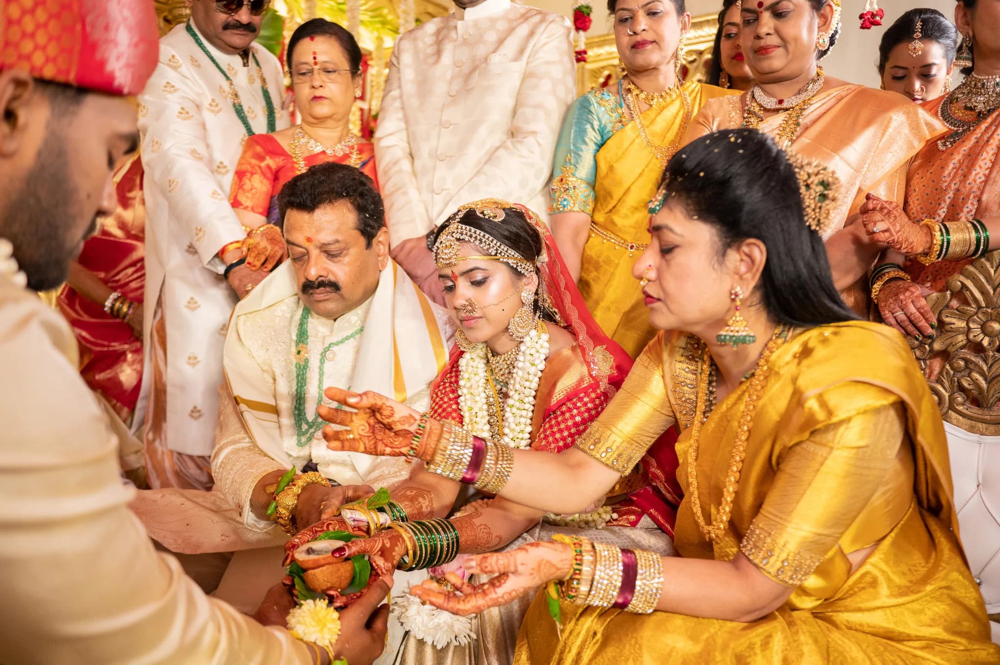 A bride at the mandap during a traditional Indian wedding ritual — the kind of moment clients star as a favorite in their RawDrive gallery.